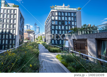 New york, usa august 20,2024. High line park pathway and modern residential buildings in chelsea, manhattan, new york city, featuring hudson yards skyline 140018309