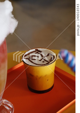 Latte Art in Yellow Cup Latte Art in Yellow Cup 140018543