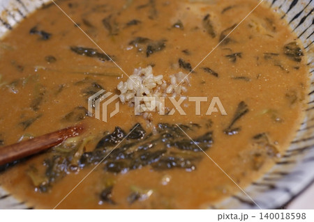 Bowl of Leafy Soup with Rice 140018598