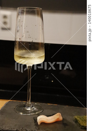 Champagne Glass with Bubbles and Seafood on Slate Champagne Glass with Bubbles and Seafood on Slate 140018675