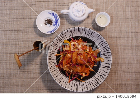 Asian Meal with Tea Set on Woven Tablecloth Asian Meal with Tea Set on Woven Tablecloth 140018694