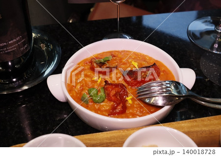 Risotto with Tomatoes and Basil in White Bowl Risotto with Tomatoes and Basil in White Bowl 140018728