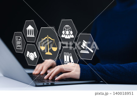 Digital law and legal consultancy concept. A person working on a laptop with virtual icons legal scales, a courthouse, a gavel, documents, handshake agreements, online legal services, and justice. Digital law and legal consultancy concept. A person working on a laptop with virtual icons legal scales, a courthouse, a gavel, documents, handshake agreements, online legal services, and justice. 140018951