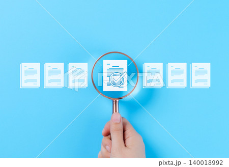 Document Review and Quality Control Process Concept. A hand holding a magnifying glass focuses on a document with a checkmark, document review, and approval processes. Certificate management, Audit, Document Review and Quality Control Process Concept. A hand holding a magnifying glass focuses on a document with a checkmark, document review, and approval processes. Certificate management, Audit, 140018992
