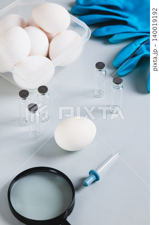 Protection against salmonella from chicken eggs, eggs on the table vertical view 140019192