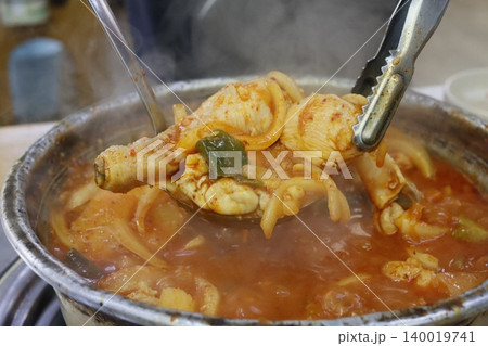 Steaming Korean Chicken Hot Pot with Tongs Steaming Korean Chicken Hot Pot with Tongs 140019741