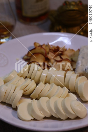 Cheese Plate with Sliced Cheese and Dried Fruit Cheese Plate with Sliced Cheese and Dried Fruit 140019746