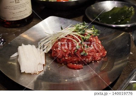Raw Beef Dish with Sesame and Garnishes Raw Beef Dish with Sesame and Garnishes 140019776