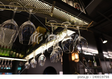 Wine Glasses Hanging in Bar Interior Wine Glasses Hanging in Bar Interior 140019798