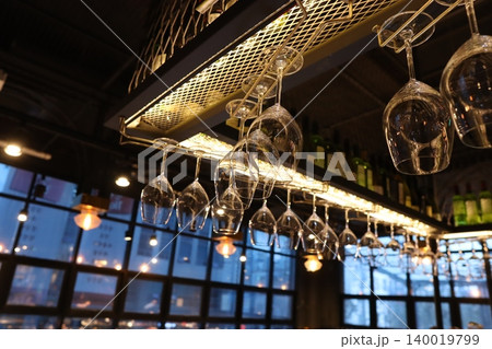Wine Glasses Hanging in Modern Bar Interior 140019799