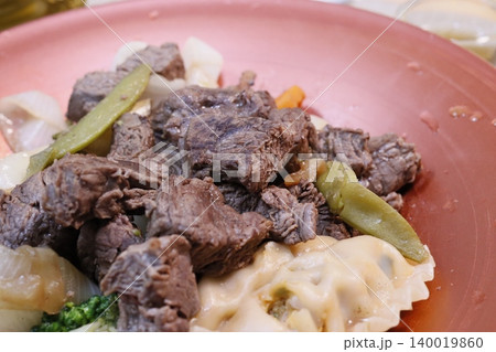 Beef and Vegetable Dish on Pink Plate Beef and Vegetable Dish on Pink Plate 140019860