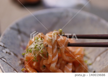 Salmon Sashimi with Sprouts on Chopsticks Salmon Sashimi with Sprouts on Chopsticks 140019886