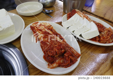 Korean Kimchi and Tofu Platter on Wooden Table Korean Kimchi and Tofu Platter on Wooden Table 140019888