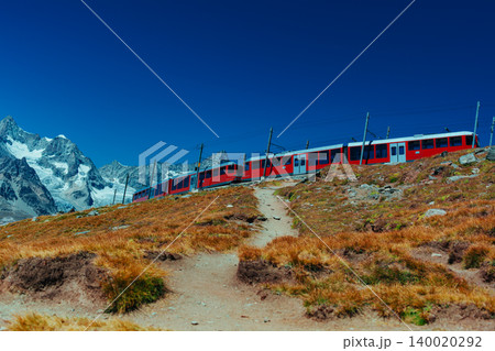 Red train in high Alps mountains Red train in high Alps mountains 140020292