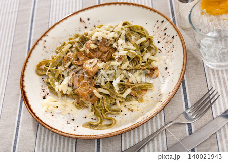 Delicious pasta served in mushroom sauce on platter Delicious pasta served in mushroom sauce on platter 140021943