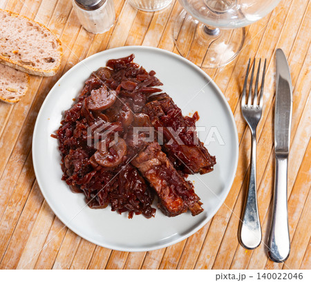 Delicious pork ribs stewed in gravy with sauerkraut close up 140022046