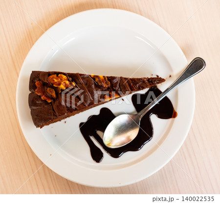 Piece of brawny with walnuts served in a plate Piece of brawny with walnuts served in a plate 140022535