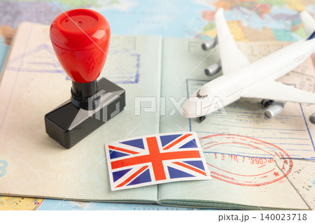 UK United Kingdom flag with passport and airplane for travel. 140023718