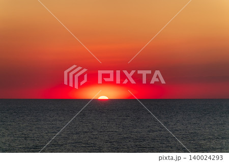 Beautiful red and orange sunrise over the sea. 140024293
