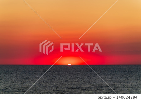 Beautiful red and orange sunrise over the sea. 140024294