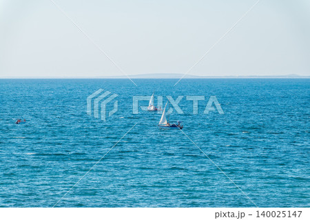 Sailing yacht in the blue calm sea. Sailing yacht in the blue calm sea. 140025147