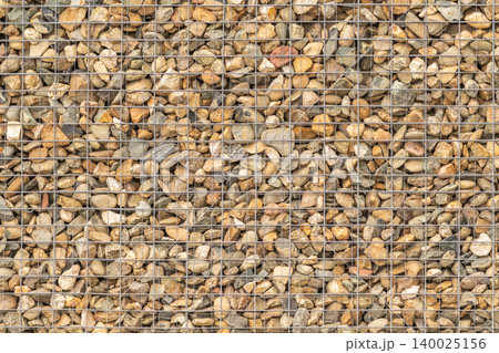 Modern Gabion Wall From Rocks And Stones In Metal Wire Box. Reinforcement and Abutment Protective Construction 140025156