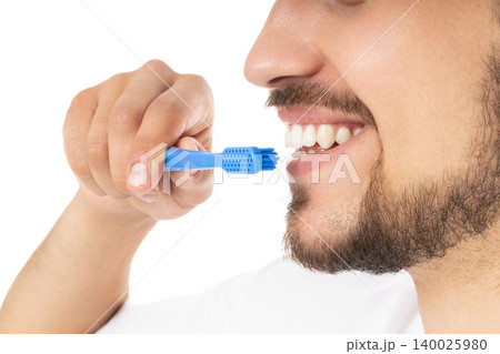 Man promotes hygiene with a toothbrush, isolated, PNG Man promotes hygiene with a toothbrush, isolated, PNG 140025980