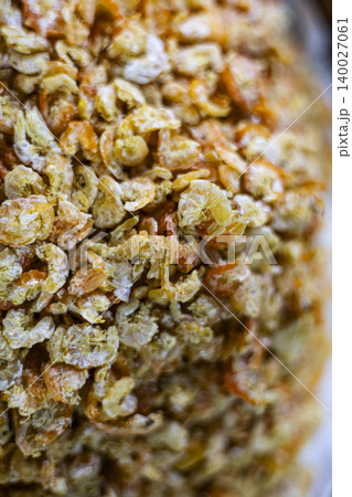 Dried Shrimps On Display At A Traditional Seafood Market. Close up of small dried shrimps for sale in local market, perfect for asian cuisine, ingredient and seafood industry themes. 140027061