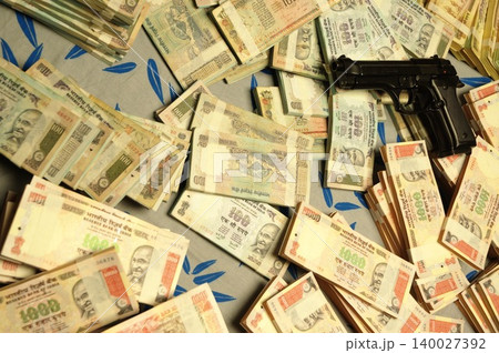 Indian Currency Gun on Bed 140027392
