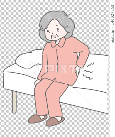 An elderly woman suffering from lower back pain upon waking up in bed. 140027552