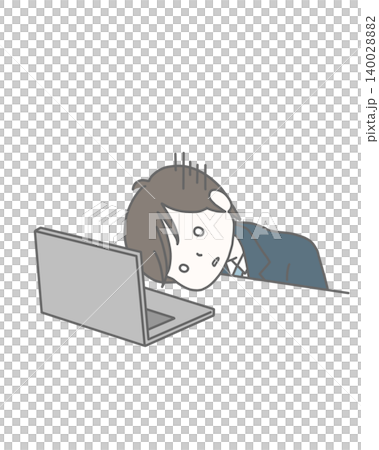 A man in a suit, looking despairing and depressed in front of his computer. 140028882