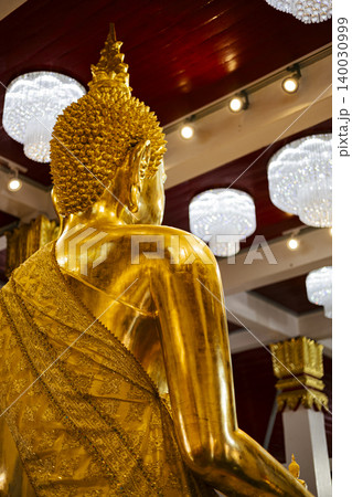 Back View Buddha Statue Wat Phra That Choeng Chum Worawihan, Golden sculpture for thailand travel marketing campaign, brand awareness, authentic buddhism culture and religious belief landmark. 140030999