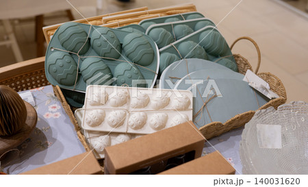 Decorative egg molds and tableware arranged on store display Decorative egg molds and tableware arranged on store display 140031620