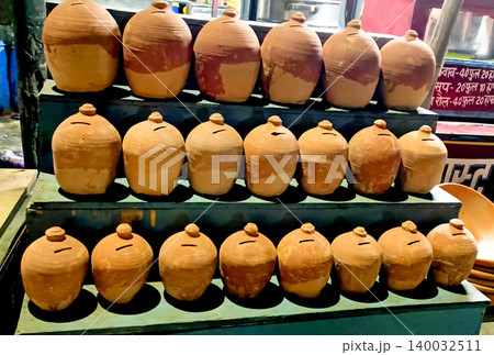 Traditional Clay Piggy Banks Displayed at Street Market Stall in India Traditional Clay Piggy Banks Displayed at Street Market Stall in India 140032511