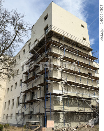 Building construction site with scaffolding Building construction site with scaffolding 140034507