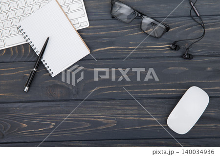 Modern workplace with smartphone and keyboard copy space on wood background. Top view. coffee cup. Modern workplace with smartphone and keyboard copy space on wood background. Top view. coffee cup. 140034936