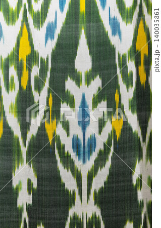 Colorful handwoven ikat textile featuring bold motifs Colorful handwoven ikat textile featuring bold motifs 140035861