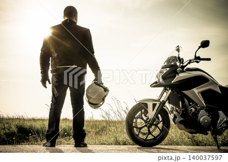 Biker on a misty sunset Biker on a misty sunset 140037597