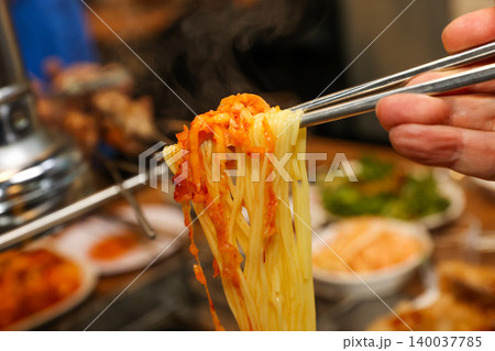 Bowl of Spicy Corn Noodle Soup at Asian Barbecue Restaurant 140037785