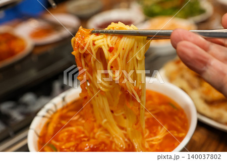 Bowl of Spicy Corn Noodle Soup at Asian Barbecue Restaurant Bowl of Spicy Corn Noodle Soup at Asian Barbecue Restaurant 140037802