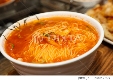 Bowl of Spicy Corn Noodle Soup at Asian Barbecue Restaurant Bowl of Spicy Corn Noodle Soup at Asian Barbecue Restaurant 140037805
