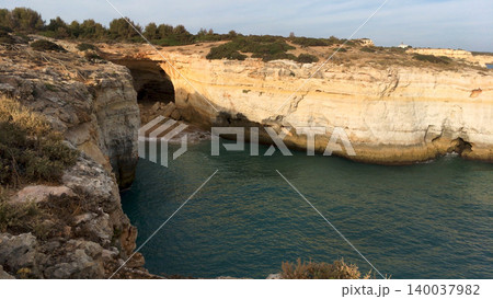 High Angle View of Sea Cave and Coastal Limestone Cliffs in Algarve Portugal High Angle View of Sea Cave and Coastal Limestone Cliffs in Algarve Portugal 140037982