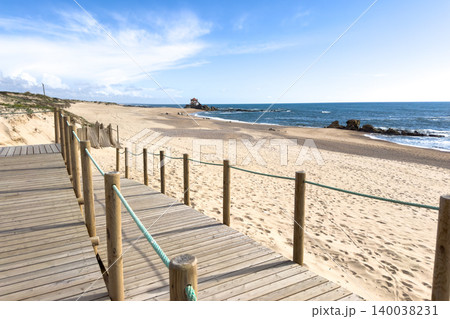 Wooden Boardwalk at Miramar Beach Overlooking the Atlantic and Senhor da Pedra Chapel 140038231