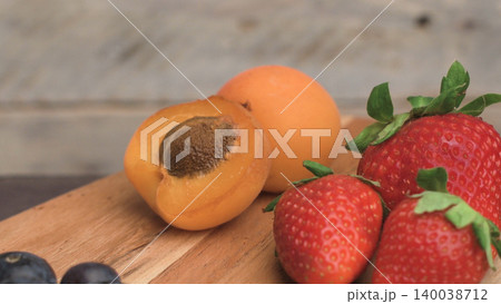 Wooden board with fresh organic fruit and berries Wooden board with fresh organic fruit and berries 140038712