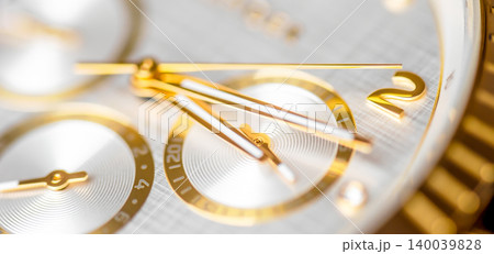 Macro view of golden watch dial and hands close up 140039828