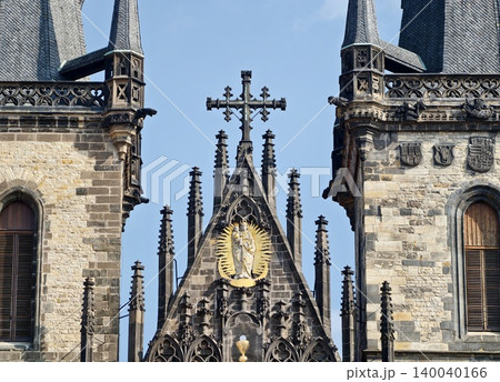 Church towers photography. Photograph capturing historic church with gabled roof and cathedral spires Church towers photography. Photograph capturing historic church with gabled roof and cathedral spires 140040166