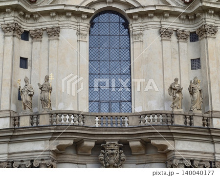 Decorative historic building features. Classical stone facade with balustrades and arched windows Decorative historic building features. Classical stone facade with balustrades and arched windows 140040177