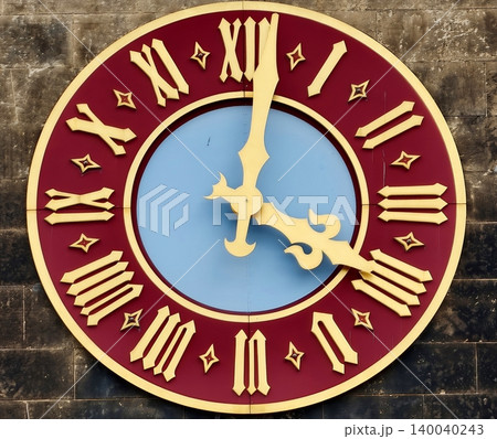 Oldfashioned clock with weathered stone background and gilded details highlighting craftsmanship 140040243