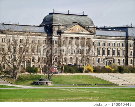 Historical municipal building set in landscaped park with seating and planting arrangements Historical municipal building set in landscaped park with seating and planting arrangements 140040445