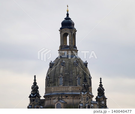 Decorative stone monument with detailed features. Artistic dome with weathered textures and intricate carvings 140040477